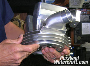 Dickinson shows us the billet cylinder head of a Jawa engine that was hand made by his father.