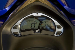 An all-digital dash is easy to read, with a large tach and speedometer to the left. A display reports the remaining riding time based on available fuel and present speed.
