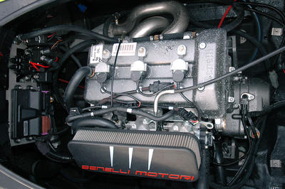 The 1,098cc Benelli motor looks small in the engine compartment.